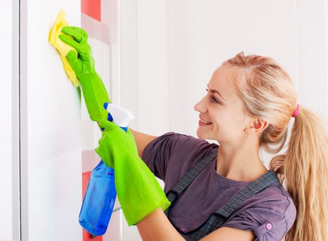 Professionals cleaning a rug with advanced equipment